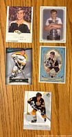 Top side of 5 Bobby Orr hockey cards showing different styles and poses including a formal portrait, trophy holding, and action shot.
