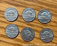 Six 1953 Canadian 5 cent nickel coins showing reverse side with beaver on rock design and year 1953.
