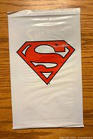 Front side of sealed comic book showing Superman 'S' shield logo