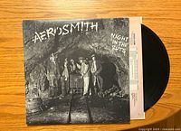 Front cover of the Aerosmith Night in the Ruts album with black vinyl visible.