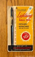 Front view of vintage packaging showing Eversharp Lightning ballpoint pen in clear plastic blister, with text highlighting features like refillable, retractable, no cap, ink color matching pen color, and price of 49 cents.