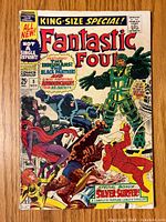 Colorful front cover of Fantastic Four Annual #5 comic book showing main characters and various Marvel superheroes in action.