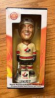 Front view of Mario Lemieux bobblehead in original box showing detailed painting and Canada team uniform.