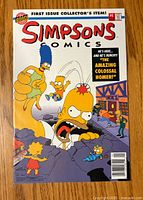 Front cover of Simpsons Comics #1 showing giant Homer and family with Moe's Tavern in background