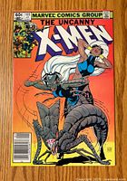 Front cover showing The Uncanny X-Men #165 Marvel comic book with large creature and X-Men characters in action.