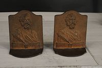 Front view showing embossed bust of Henry W. Longfellow and text on both bookends