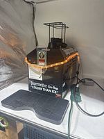 Front view of Jagermeister dispenser showing spout, drip tray, lighting and branding.