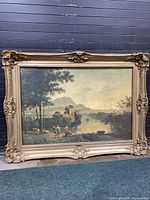 Front view of the large framed Italian countryside print showing the ornate gold-toned frame and detailed scene.