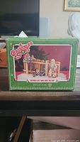 Box packaging showing the Department 56 A Christmas Story figurine titled 'Ralphie & The Escapees'.