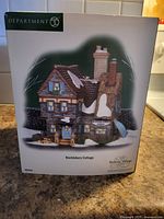 Original retail box showing image of Bucklebury Cottage from Department 56 Dickens' Village series