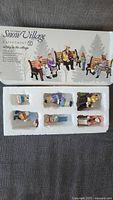 Original boxed set of 6 Department 56 Snow Village figurines showing packaging and layout of figures