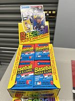 Front view of the open 1989 Donruss baseball puzzle and cards wax box showing multiple sealed packs inside.