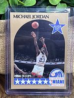 Front of 1990 NBA Hoops Michael Jordan All Star basketball card, showing Jordan shooting in East All-Star uniform with NBA Hoops and All Star Weekend Miami Feb 9-11, 1990 logos