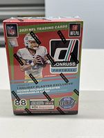 Front view of sealed 2021 NFL Donruss Holiday Blaster trading card box featuring Justin Herbert image and Panini branding.