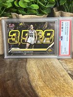 Close-up of the front of the Caitlin Clark card showing her in Iowa basketball uniform with bold 3,528 scoring record, in PSA slab.