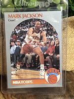 Front of the Mark Jackson 1990 NBA Hoops basketball card showing the player in action with Knicks logo in bottom right.