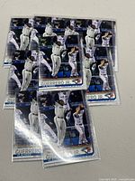 10 Topps 2019 Vladimir Guerrero Jr baseball rookie cards in near mint condition, card number US 62, each in protective sleeve showing player jumping in celebration.