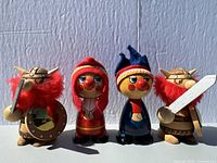 Four vintage Fufel wooden figures: two Vikings with red beards and weapons, two round-faced characters in colorful hats