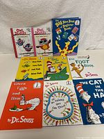 Full lot of 9 children's early reader books laid out on a surface, showing colorful covers and titles by Dr. Seuss and Owl Diaries.