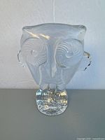 Front view of clear crystal owl figurine showing detailed eyes, beak, and base.