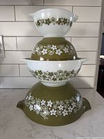 Stacked set of four Pyrex Cinderella bowls showing pattern and sizes