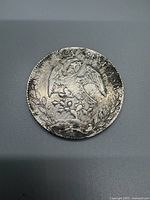 Front side of the coin showing the Mexican eagle perched on a cactus with a snake in its beak and the inscription 'REPUBLICA MEXICANA'.