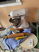 Overall view of mixer, bowl and all accessories on table