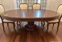 Front view of extended table with chairs