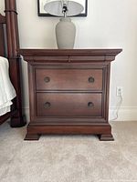 Front view showing two full-width drawers and molding on top edge