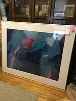 Front view of the large pastel print artwork in white mat and plastic cover.