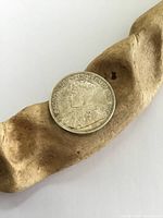 Obverse side of the 1936 Canadian silver dollar showing King George V profile portrait and inscriptions.