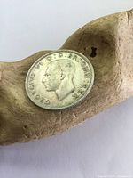 Obverse side of the 1942 silver coin showing King George VI profile and inscriptions.