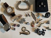 Overview of all vintage jewelry items including watches, bracelet, brooches, keychain, earrings, and ring.