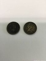 Photo showing obverse side of two Canadian dimes with Queen Elizabeth II profile dated 1961 and 1966.