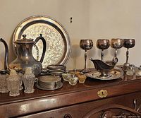 Full view of collection including coffee pot, tray, four goblets, coasters, crystal salt and pepper shakers, and additional glass salt and pepper shakers.