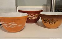 All three bowls displayed with Autumn Harvest and Old Orchard patterns visible