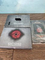 Original packaging and documentation for Droid XY Board tablet device, showing brand and series name on box and manual.