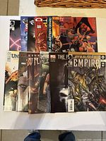 Front covers of a mix of comic books from various publishers and series laid out flat