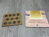 Jefferson Silver Nickel set displayed on cardboard holder with slots for coins dated 1942-1945 including three mint marks: P, S, and D. Next to it is the box for Bill of Rights commemorative half dollar and James Madison medal.