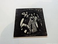 Front cover of Alice Cooper 'Love It to Death' LP album showing the band in black and white with stylized artwork.