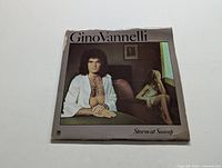 Front cover of Gino Vannelli LP 'Storm at Sunup' showing artist and wear on one corner of cover.