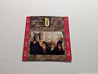 Front cover of Glass Tiger Thin Red Line vinyl LP showing band members and album title with red bordered design.
