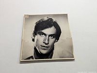 Front cover of James Taylor "JT" album in black and white with portrait of James Taylor.
