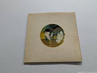 Front cover of Seals & Crofts Summer Breeze LP showing illustrated portrait of two men within a circle on cream background with the title and artist names.