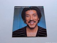 Front cover of Smokey Robinson "Being With You" vinyl LP showing a close-up portrait against blue background.