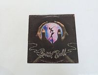 Front cover of Styx Crystal Ball vinyl LP showing album art with hands holding a crystal ball and dancer silhouette.