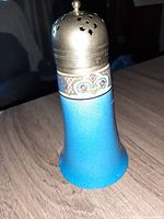 Sugar shaker with blue ceramic base, decorated floral band, and silver plated perforated lid with knob