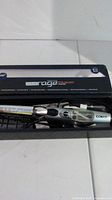 Metal Conair Hair Rage curling iron in original box showing front view of product and branding on box.