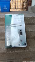 Box of Uberhaus Design Alexandria Series bathtub and shower faucet set with product image on front.