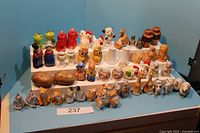 Wide view showing all 26 sets on display including various animal and character salt and pepper shakers.